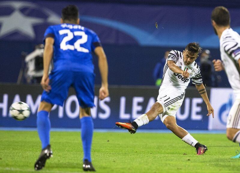 Juventus’ Paulo Dybala, right, in action against Dinamo Zagreb’s Leonardo Sigali. Antonio Bat / EPA