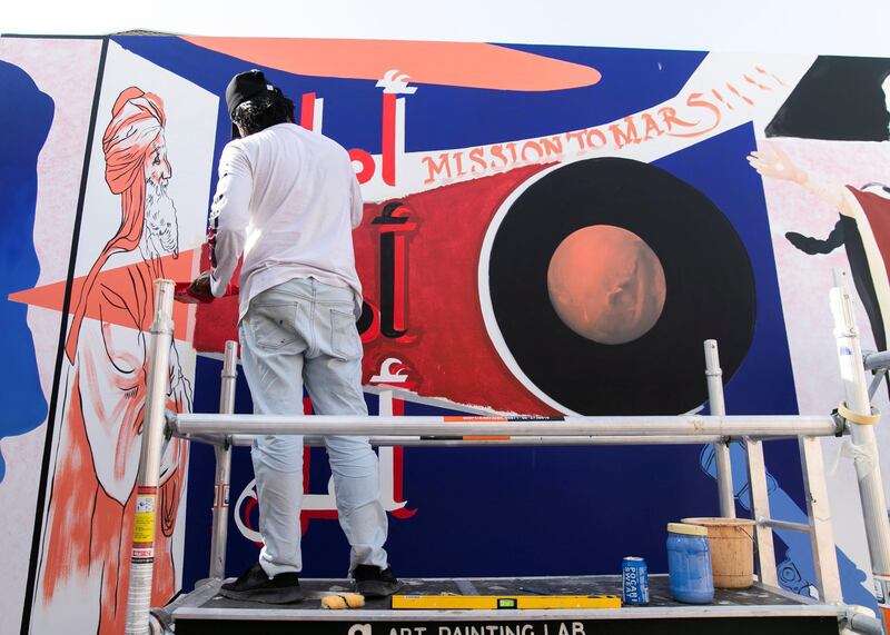 DUBAI, UNITED ARAB EMIRATES. 25 JULY 2020. 
Artists Amna Basheer and Reem Al Mazrouei work on their commission for Dubai Culture. They are painting a “Hope mural” to celebrate the UAE Mars mission in Dubai’s Al Fahidi district. (Photo: Reem Mohammed/The National)

Reporter:
Section: