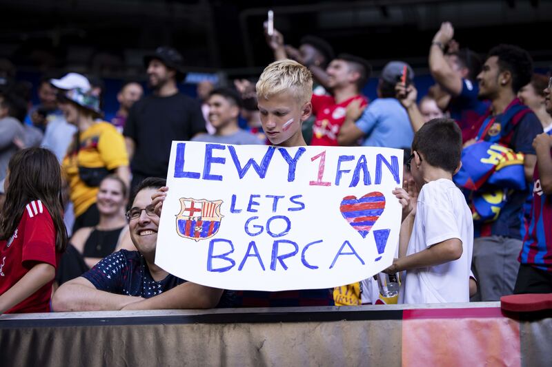 A fan holds a sign in support of Robert Lewandowski. Getty
