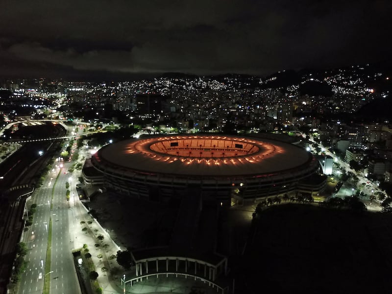 The Maracana stadium is seen illuminated with golden lights to honour Pele. Reuters