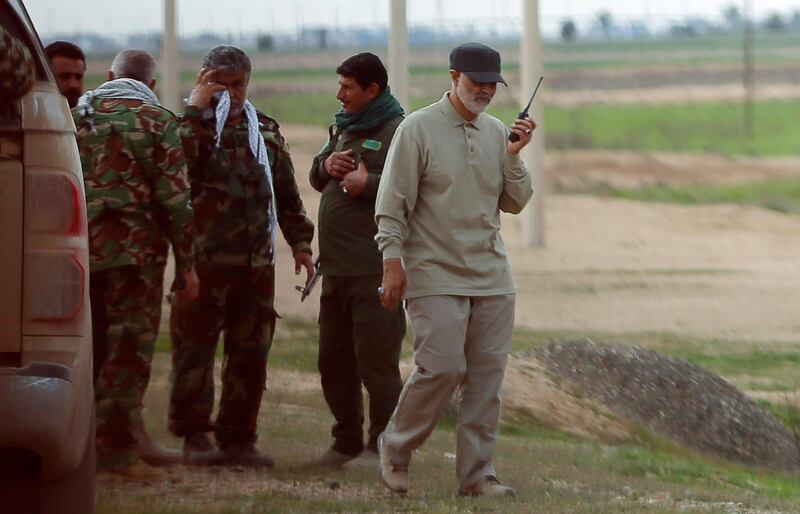 Iranian Revolutionary Guard Commander Qassem Soleimani uses a walkie-talkie at the frontline during offensive operations against Islamic State militants in the town of Tal Ksaiba in Salahuddin province March 8, 2015. Picture taken March 8, 2015.   REUTERS/Stringer (IRAQ - Tags: CIVIL UNREST CONFLICT POLITICS)