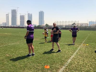 Mike Brown, centre, taking part in a training session at Dubai College.