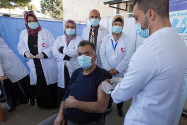 A health worker in Bethlehem receives a dose of the Moderna Covid-19 vaccine on February 3, 2021. AP