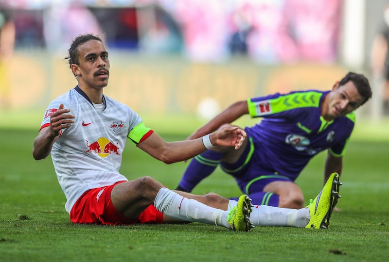 Leipzig's Yussuf Poulsen, left, and Nicolas Hoefler of Freiburg. AFP