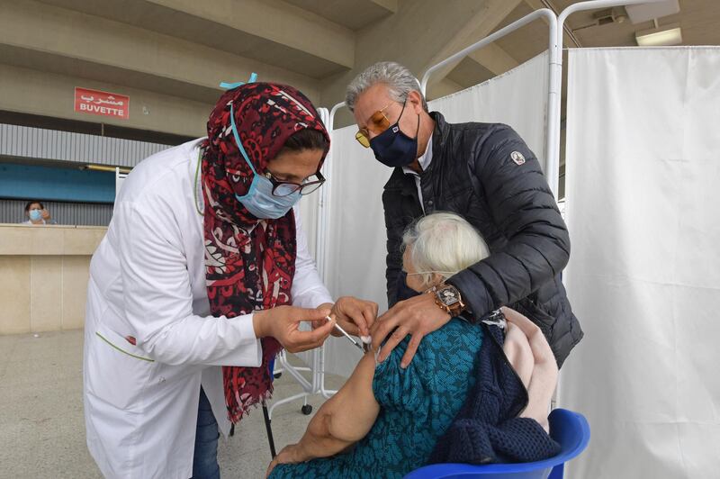 Many Tunisians mistrust the vaccines and are hesitant about side effects. AFP