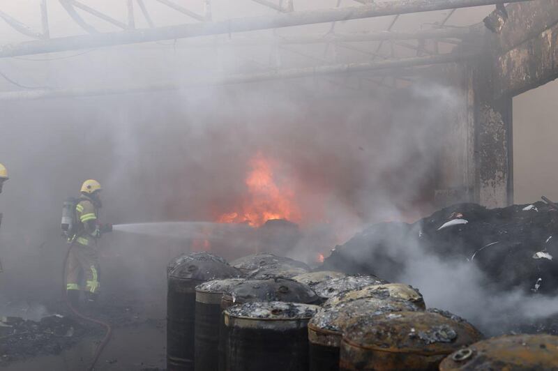 Firefighters douse the flames in the tyre factory. Courtesy UAQ Civil Defence.