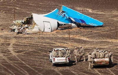 The Egyptian military approach a section of the wreckage of the Russian passenger plane that crashed  after taking off from Sharm El Sheikh in October 2015. Maxim Grigoriev / Russian Ministry for Emergency Situations via AP