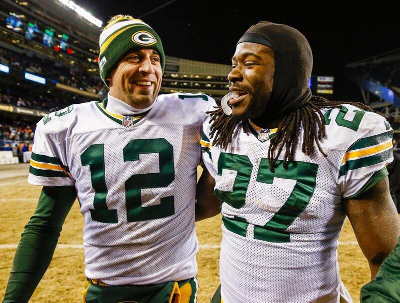 Green Bay Packers quarterback Aaron Rodgers, left, and running back Eddie Lacy smile as they walk off the field following their last-minute victory over Chicago Bears at Soldier Field in Chicago on Sunday. The Packers earned a play-off spot with the victory. EPA / TANNEN MAURY
