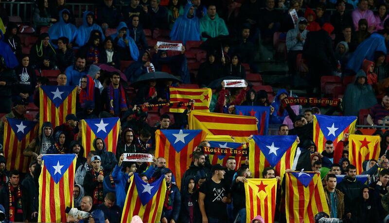 Supporters hold 'Estelada', the pro-independence Catalan flag during the Spanish La Liga soccer match between FC Barcelona and Sevilla at the Camp Nou stadium in Barcelona, Spain, Saturday, Nov. 4, 2017. (AP Photo/Manu Fernandez)