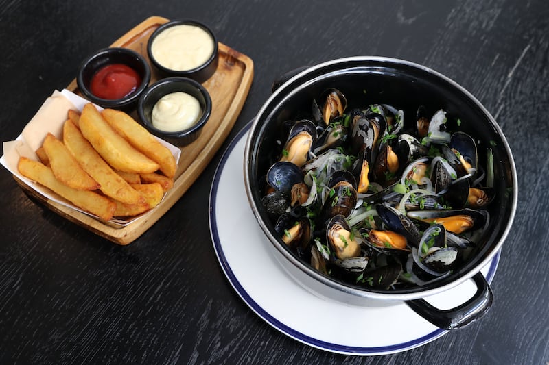 Mussels naturale (steamed in their natural juices with fennel, celery and onion), served with Belgian fries and traditional mussel dip at Le Petit Belge