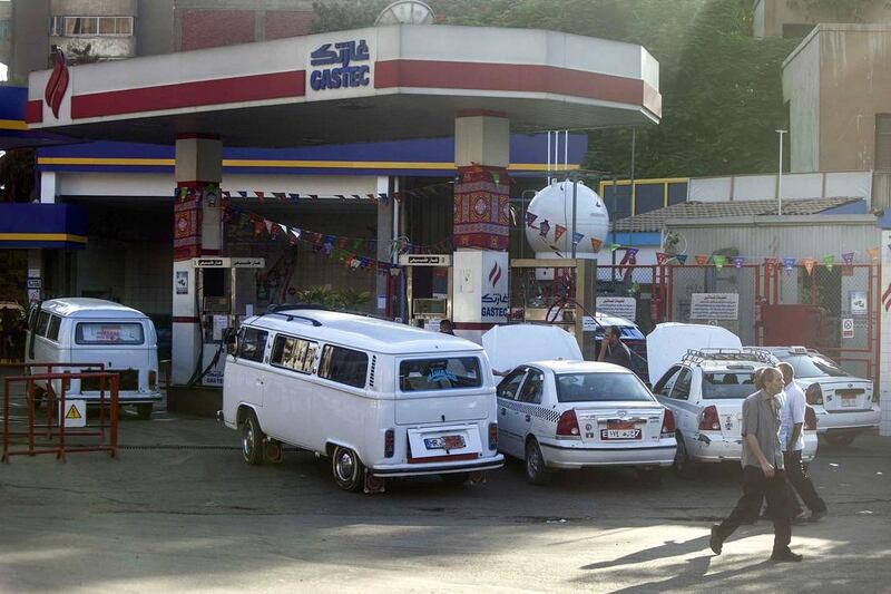 Egyptians queue at a petrol station in Cairo. Mahmoud Khaled / AFP