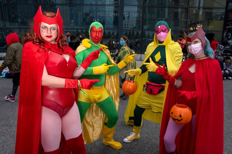 Couples dressed as Wanda Maximoff and Vision meet during the 2021 New York Comic Con at the Jacob K  Javits Convention Centre in New York. Charles Sykes / Invision / AP