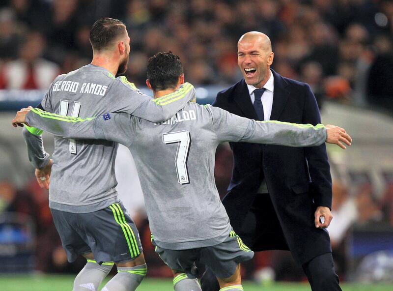ROME, ITALY - FEBRUARY 17:  Cristiano Ronaldo with Sergio Ramos and Zinedine Zidane of Real Madrid CF celebrates after scoring the opening goal during the UEFA Champions League round of 16 first leg match between AS Roma and Real Madrid CF at Stadio Olimpico on February 17, 2016 in Rome, Italy.  (Photo by Paolo Bruno/Getty Images)