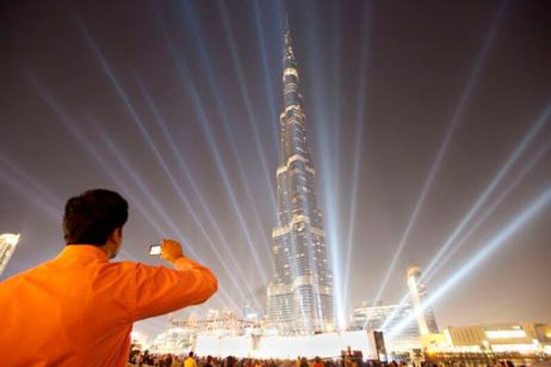 UAE - Dubai - Dec 01 - 2010:  Light show at Burj Park - Burj Khalifa during the celebration of the 39th national Day anniversary, Kullunna Khalifa. ( Jaime Puebla - The National Newspaper )