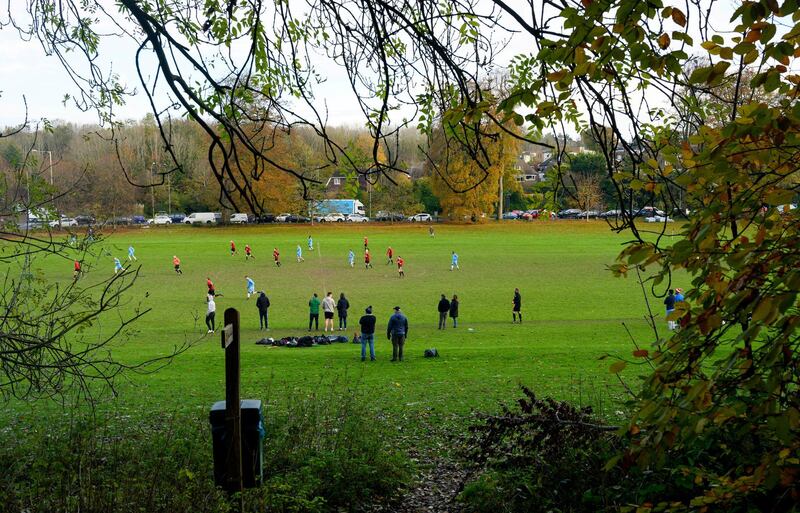 2A9PMFA Brighton UK 17th November 2019 - The Castle Club (in blue) take on Broadwater (red) in a local amateur football match against a backdrop of Autumn colours on a cold dry day at Patcham on the outskirts of Brighton. Other parts of Britain are still experiencing wet weather with more rain forecast for the next few days . Credit: Simon Dack / Alamy Live News