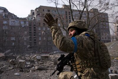 A Ukrainian serviceman in Mariupol in March 2022 before it fell to Russia. The country will want to retake the important port in its coming counter-offensive. AP 
