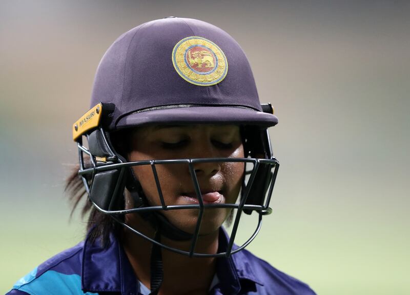 Sri Lanka's Vishmi Gunaratne walks after being by dismissed off the bowling of Scotland's Priyanaz Chatterji for nine runs.