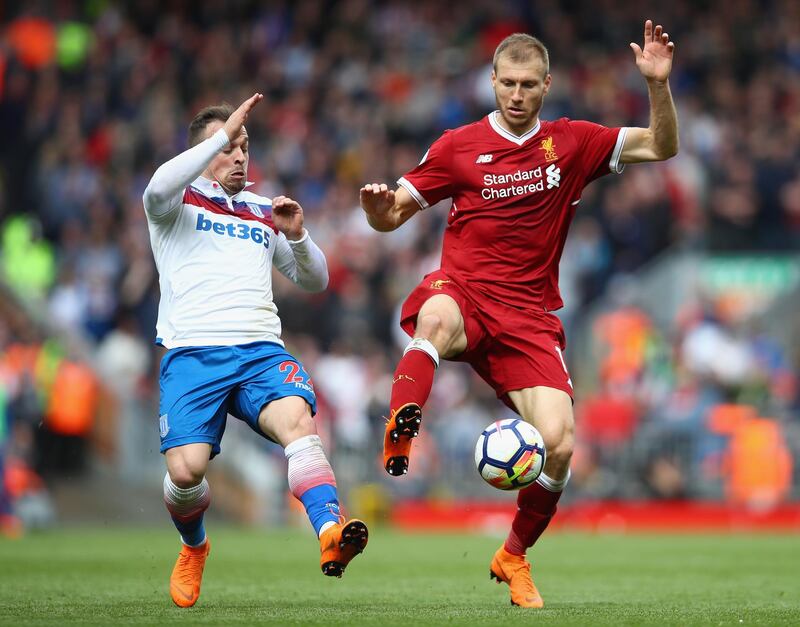 LIVERPOOL, ENGLAND - APRIL 28:  Ragnar Klavan of Liverpool and Xherdan Shaqiri of Stoke City in action during the Premier League match between Liverpool and Stoke City at Anfield on April 28, 2018 in Liverpool, England.  (Photo by Clive Brunskill/Getty Images)