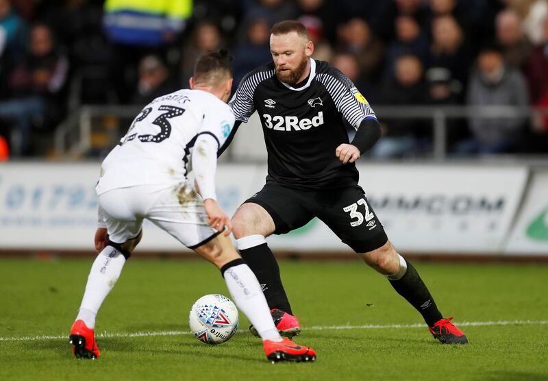 Wayne Rooney goes on the attack against Swansea in the Championship match at the Liberty Stadium on February 8. Reuters