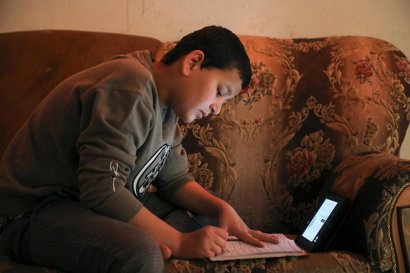 A student attends an online class from home, following the outbreak of the coronavirus disease, in the holy city of Karbala, Iraq. Reuters