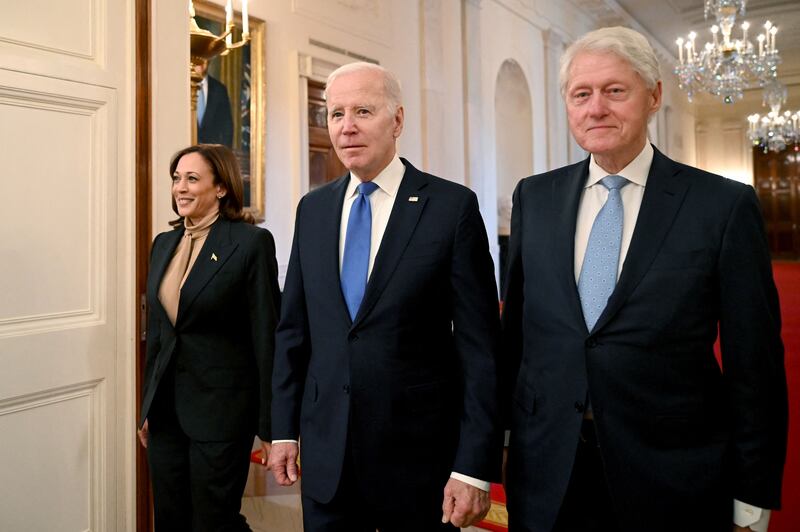 US Vice President Kamala Harris, President Joe Biden and former US president Bill Clinton arrive for an event marking the 30th anniversary of the act. AFP