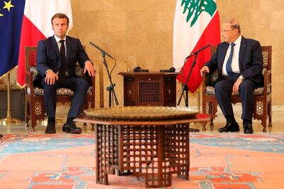 French President Emmanuel Macron (L) meets with Lebanese President Michel Aoun upon his arrival at Beirut airport, on August 6, 2020 two days after a massive explosion devastated the Lebanese capital in a disaster that has sparked grief and fury. French President Emmanuel Macron visited shell-shocked Beirut on August 6, pledging support and urging change after a massive explosion devastated the Lebanese capital in a disaster that left 300,000 people homeless. / AFP / POOL / Thibault Camus
