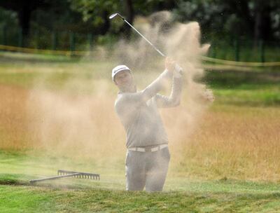 epa06896229 Jon Rahm of Spain blasts out of a bunker during a practice round prior to the British Open Golf Championship at Carnoustie, Britain, 18 July 2018.  EPA/GERRY PENNY