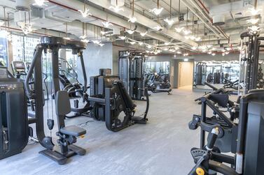 The number of people allowed to exercise in gyms in Abu Dhabi and Dubai at any one time has been reduced to curb the spread of Covid-19. Antonie Robertson / The National