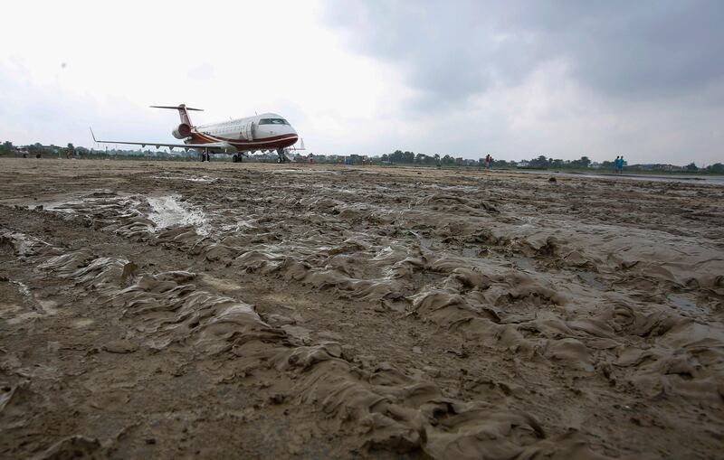 An airplane stands on a muddy airfield after flooding hit parts of Biratnagar's domestic airport in Morang district, Nepal, on August 16, 2017. The Biratnagar Airport has been closed since five days due to flooding situation. According to airport authorities it will take at least five more days to reopen the airport. More than hundreds people have died and thousands have been displaced due monsoon flooding across the country.  NARENDRA SHRESTHA / EPA