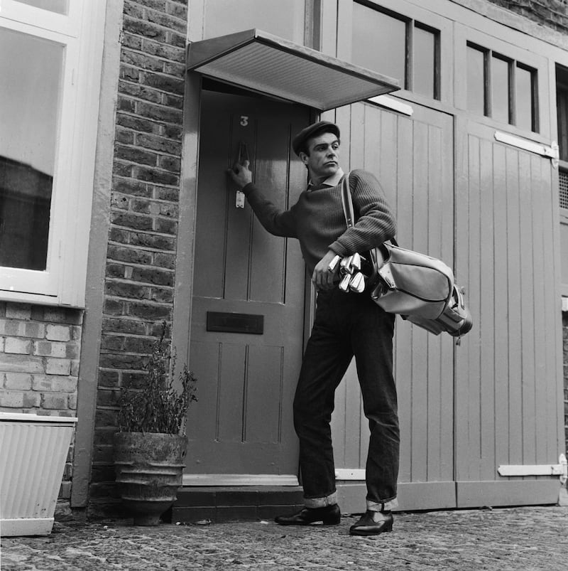 31st August 1962:  Scottish actor Sean Connery, the new face of superspy James Bond, leaves his basement flat in London's NW8 for a game of golf, his favourite pastime.  (Photo by Chris Ware/Keystone Features/Getty Images)