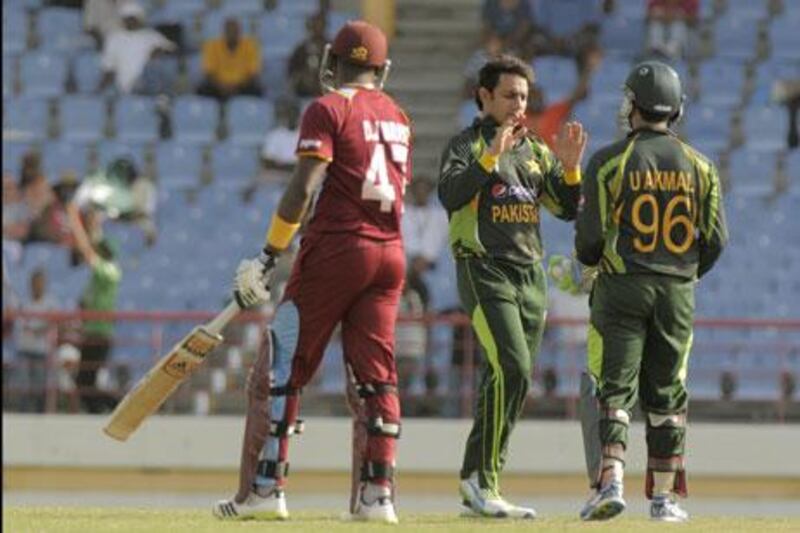 Saeed Ajmal took three wickets to stop West Indies in their tracks.