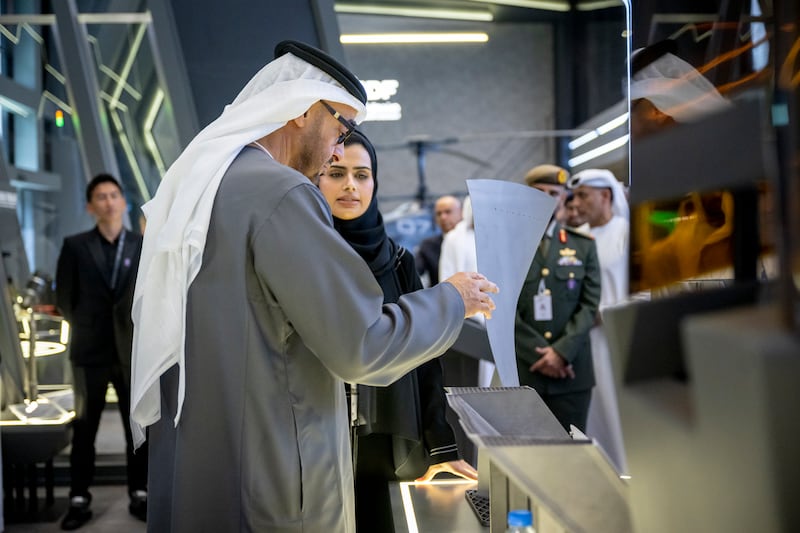 The President tours a booth at Idex, which is hosting about 1,350 companies and 350 delegations this week