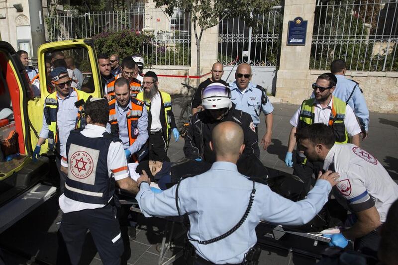 Israeli medics move the Palestinian girl Norhan Awwad, 14, who was shot in Jerusalem yesterday. Sebastian Scheiner / AP Photo