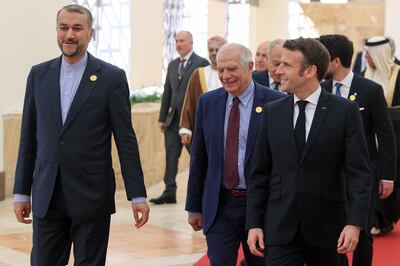 Left to right, Iranian Foreign Minister Hossein Amirabdollahian, Josep Borrell, the EU's foreign policy chief, and French President Emmanuel Macron at the conference. AP