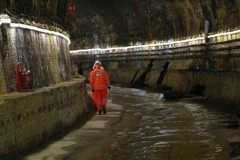 A worker walks through the Connaught tunnels section of the Crossrail project. Andrew Winning / Reuters