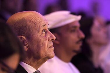 French Foreign Affairs Minister Jean-Yves Le Drian (L) listens to a speech during his visit to Abu Dhabi's Sorbonne University in the Emirati capital, on October 28, 2019. AFP