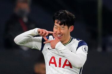 Tottenham's Son Heung-min celebrates scoring his side's first goal during the English Premier League soccer match between Tottenham Hotspur and Arsenal at Tottenham Hotspur Stadium in London, England, Sunday, Dec. 6, 2020. (Catherine Ivill/Pool via AP)