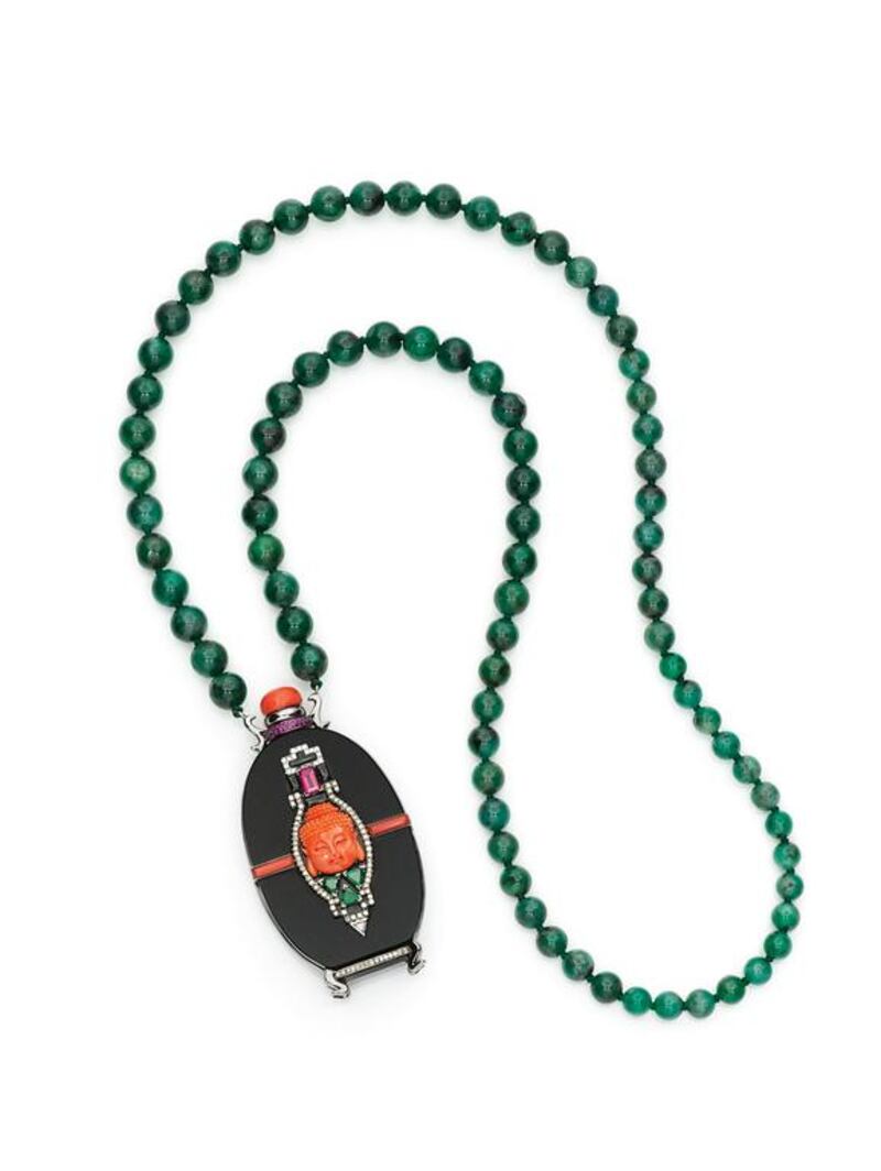 The necklace/pendant piece called Scent of the Sacred by Wendy Yue is, in fact, a snuff bottle where the top coral piece can open up to hold perfume. Courtesy Wendy Yue / The House of Luxury