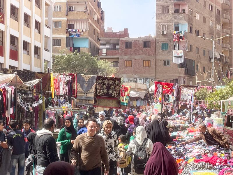 The weekly market at El Talbia in Cairo's Giza district offers shoppers everything from used clothes to fresh fish and meat. Kamal Tabikha / The National