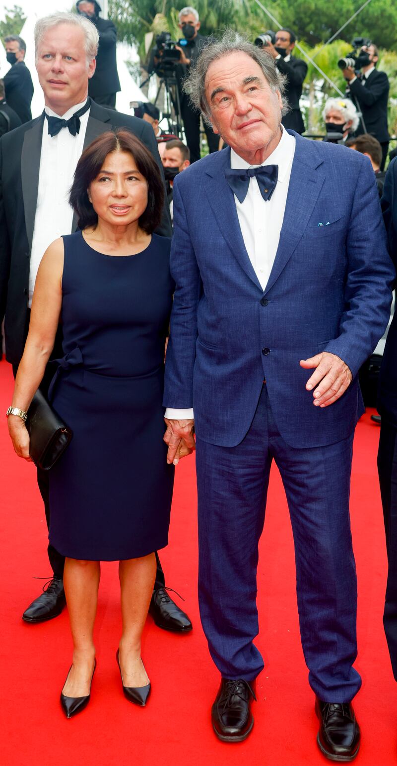 Oliver Stone and Jung Sun-jung attend the screening of 'The French Dispatch' at the 74th annual Cannes Film Festival on July 12, 2021