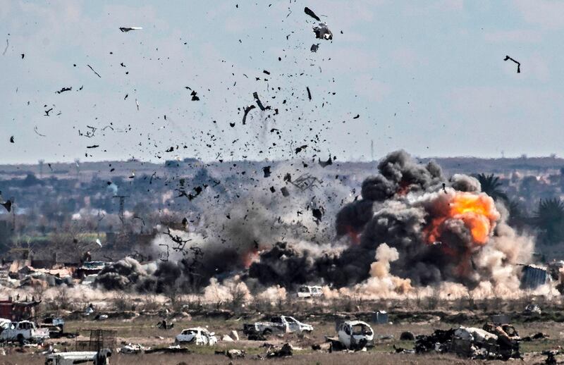 Smoke and fire billow after shelling on  Baghouz.  AFP