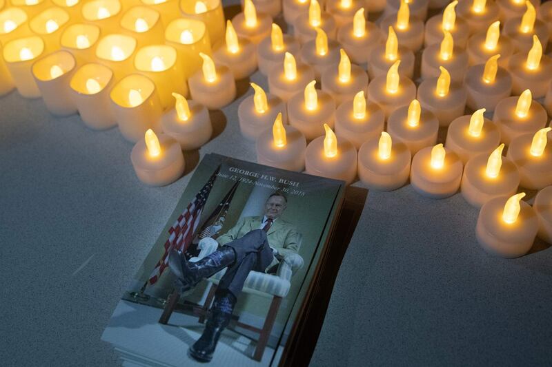 Candles are seen at a vigil organised by The Bush School of Government and Public Service at the George Bush Presidential Library in College Station, Texas. AFP