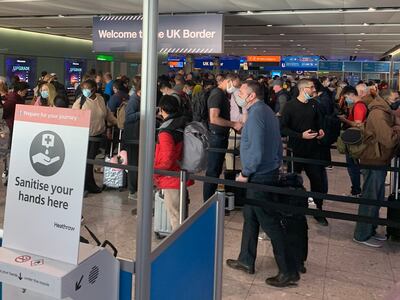 Passengers queue at passport control desks after arriving at Heathrow on Friday morning. Photo: Martin Duggan / Twitter