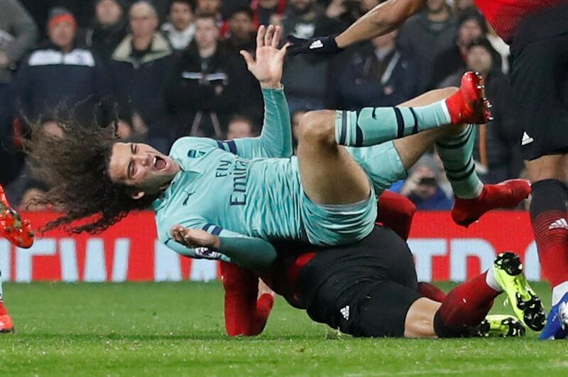 Arsenal's Matteo Guendouzi is fouled by Manchester United's Marcos Rojo during their Premier League match at Old Trafford on Wednesday. The match finished 2-2. Reuters