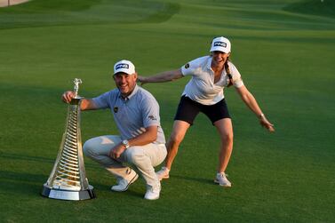 DUBAI, UNITED ARAB EMIRATES - DECEMBER 13: Lee Westwood of England and his girlfriend and caddie, Helen Storey pictured with the Race to Dubai trophy after the final round of the DP World Tour Championship at Jumeirah Golf Estates on December 13, 2020 in Dubai, United Arab Emirates. (Photo by Ross Kinnaird/Getty Images)