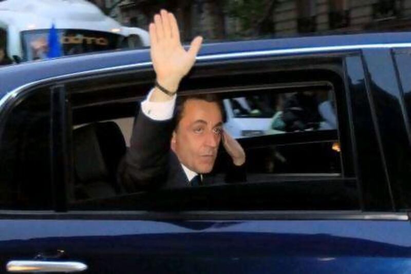 Right-wing incumbent candidate Nicolas Sarkozy leaves by car after addressing his supporters following the second round results of the French Presidential elections in Paris at " La Mutualite" hall on May 6, 2012. His opponent Socialist candidate Francois Hollande was elected France's first Socialist president in nearly two decades on Sunday, dealing a humiliating defeat to incumbent Nicolas Sarkozy and shaking up European politics. AFP PHOTO / JACQUES DEMARTHON
 *** Local Caption *** 459125-01-08.jpg