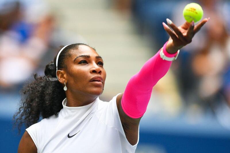 Serena Williamsserves to Johanna Larsson of Sweden. Eduardo Munoz Alvarez / AFP