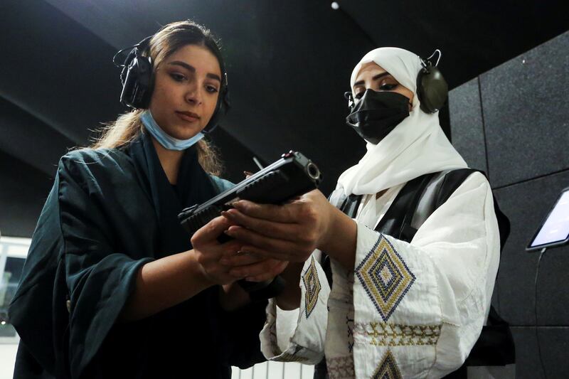 Saudi Arabian female firearms trainer Mona Al Khurais teaches a woman how to use weapons safely at the Top Gun shooting range in Riyadh. All photos: Reuters / Ahmed Yosri