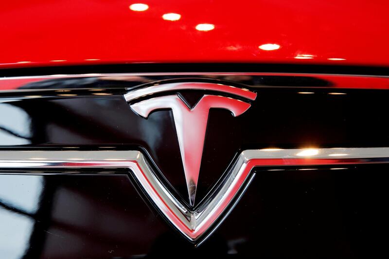 FILE PHOTO: A Tesla logo on a Model S is photographed inside of a Tesla dealership in New York, U.S., April 29, 2016. REUTERS/Lucas Jackson/File Photo