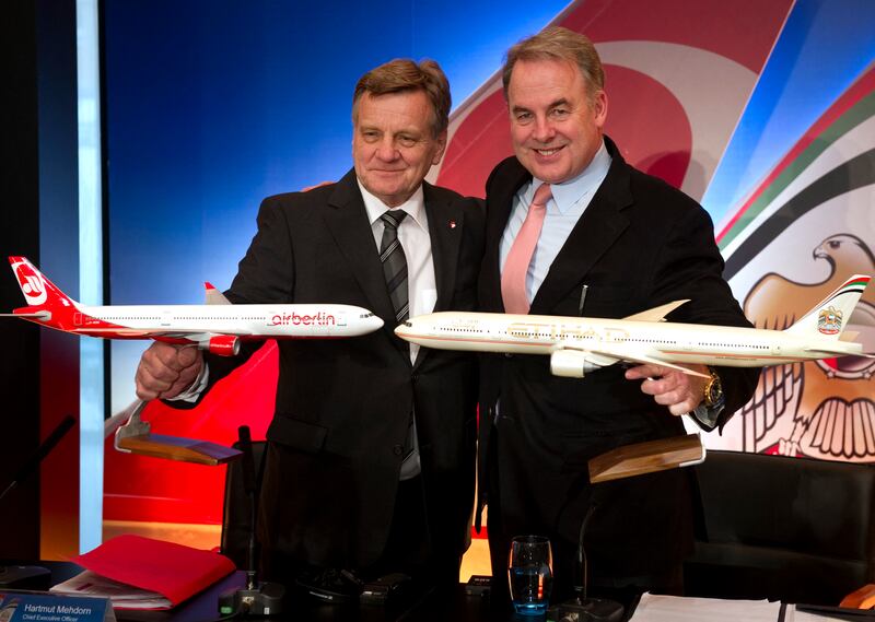 Air Berlin chief executive Hartmut Mehdorn and his Etihad Airways counterpart James Hogan pose for a picture after the UAE airline agreed to become the biggest shareholder in the German carrier in December 2011. AFP